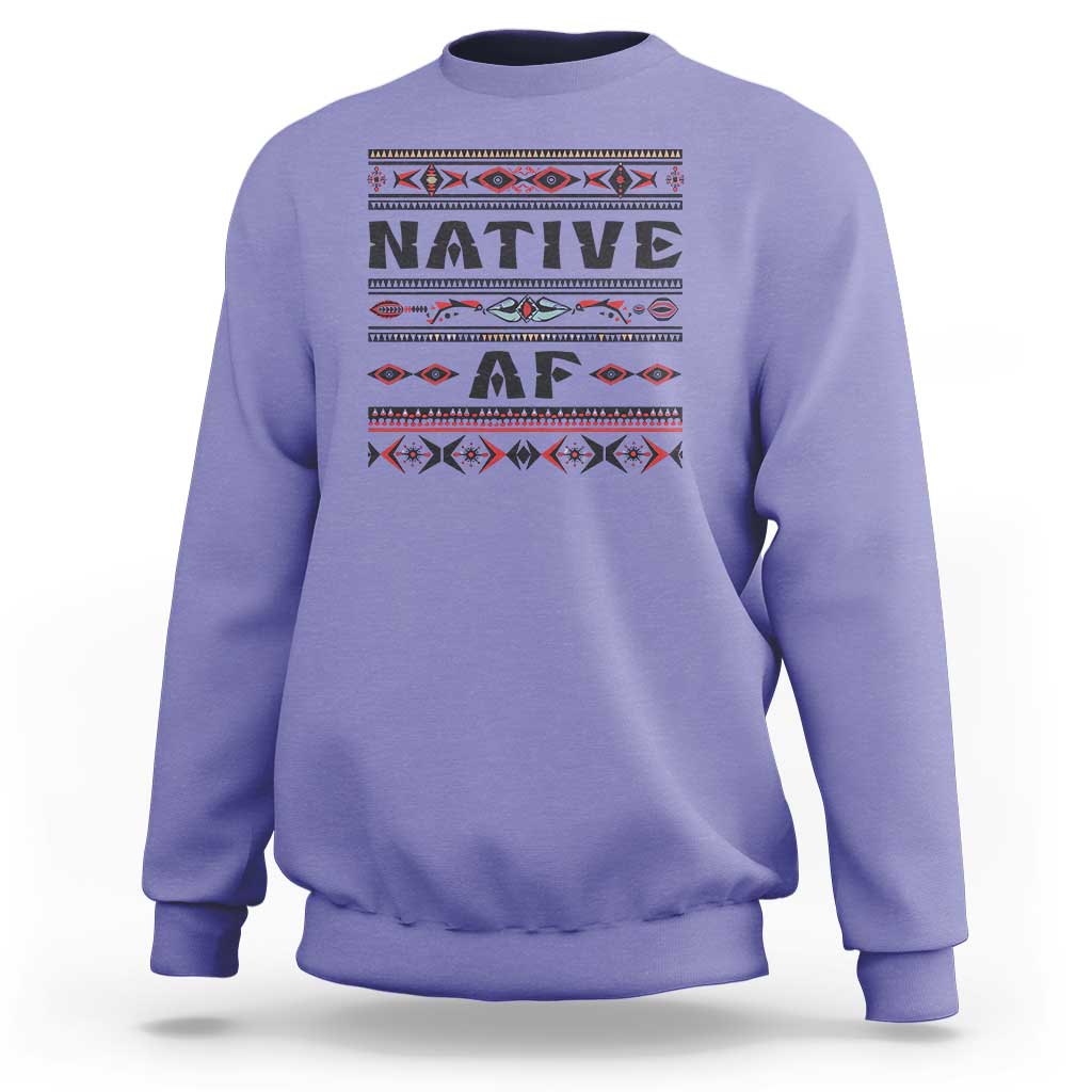 Violet crewneck sweatshirt with bold 'Native AF' geometric tribal graphic