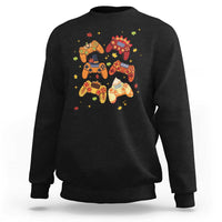 Black gaming sweatshirt with colorful controller-and-autumn icons graphic on front