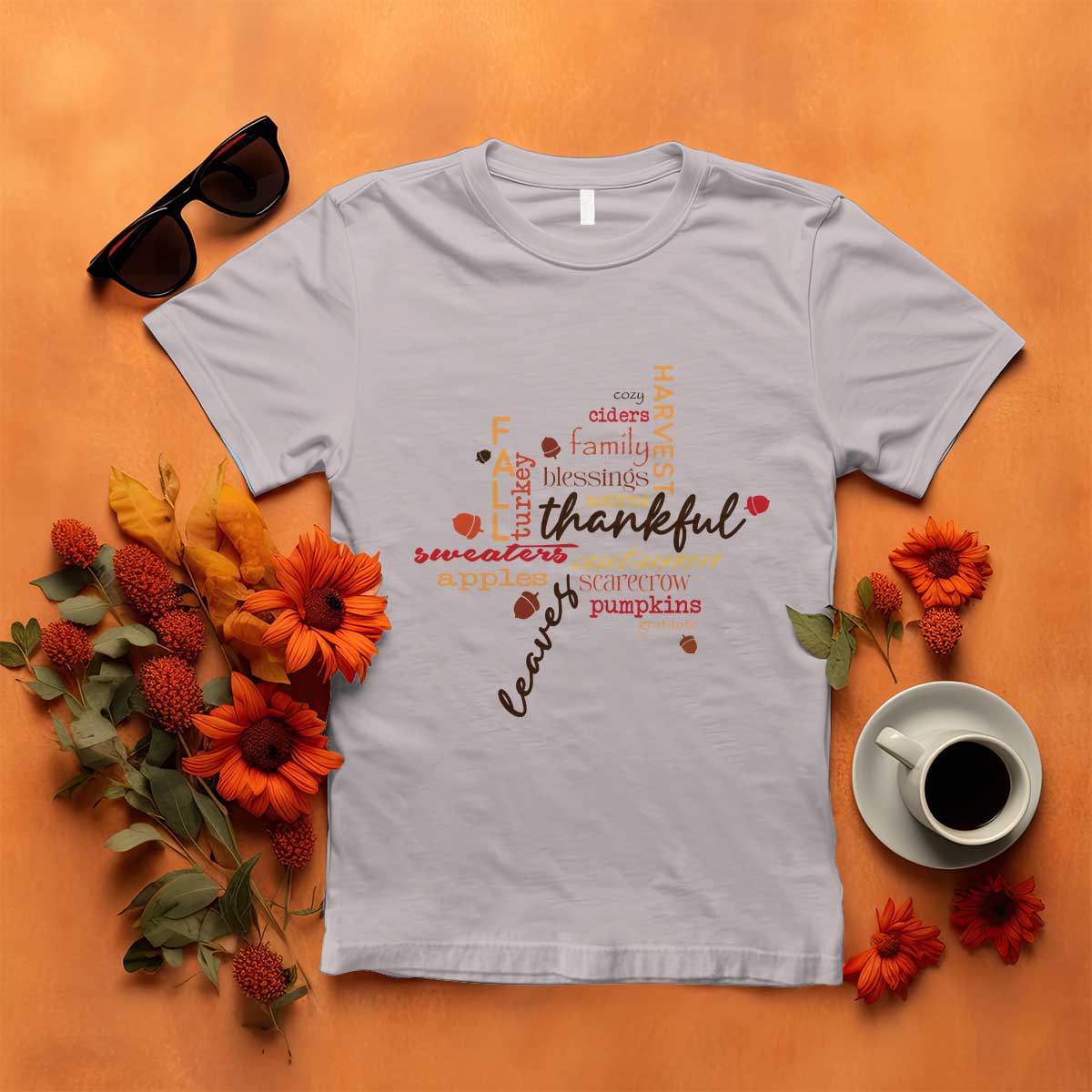Light gray T-shirt with colorful "thankful" typography and autumn maple leaf graphic