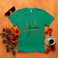 Irish green T-shirt with colorful "thankful" typography and autumn maple leaf graphic