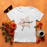 White T-shirt with colorful "thankful" typography and autumn maple leaf graphic