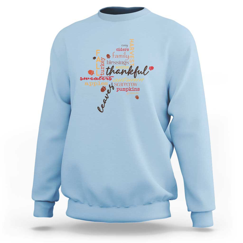 Light blue crewneck fall sweatshirt with multicolor Thanksgiving leaf word art
