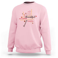 Light pink crewneck fall sweatshirt with multicolor Thanksgiving leaf word art