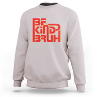 Light pink crewneck sweatshirt with 'BE KIND BRUH' graphic