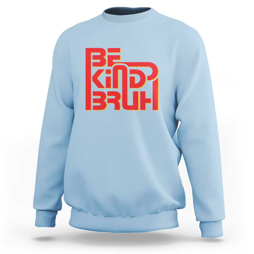 Light blue crewneck sweatshirt with 'BE KIND BRUH' graphic