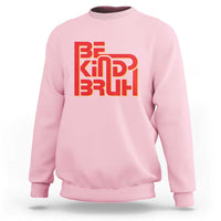 Pink crewneck sweatshirt with 'BE KIND BRUH' graphic