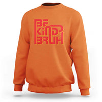 Orange crewneck sweatshirt with 'BE KIND BRUH' graphic