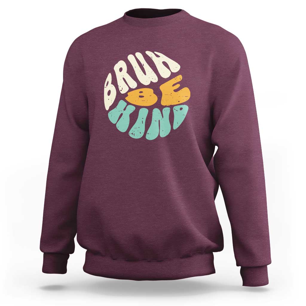 Maroon crewneck sweatshirt with BRUH kind graphic on the front