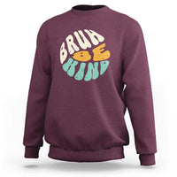 Maroon crewneck sweatshirt with BRUH kind graphic on the front