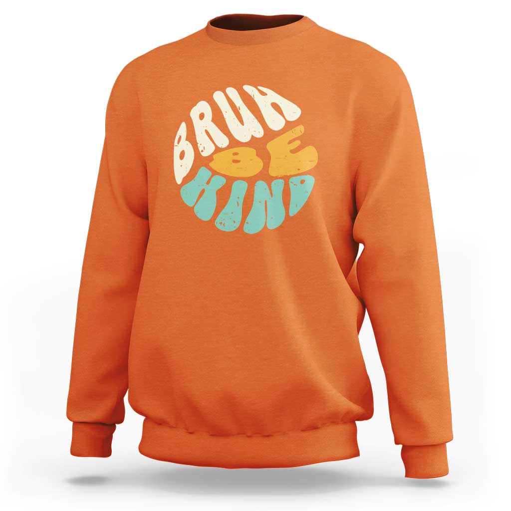 Orange crewneck sweatshirt with BRUH kind graphic on the front