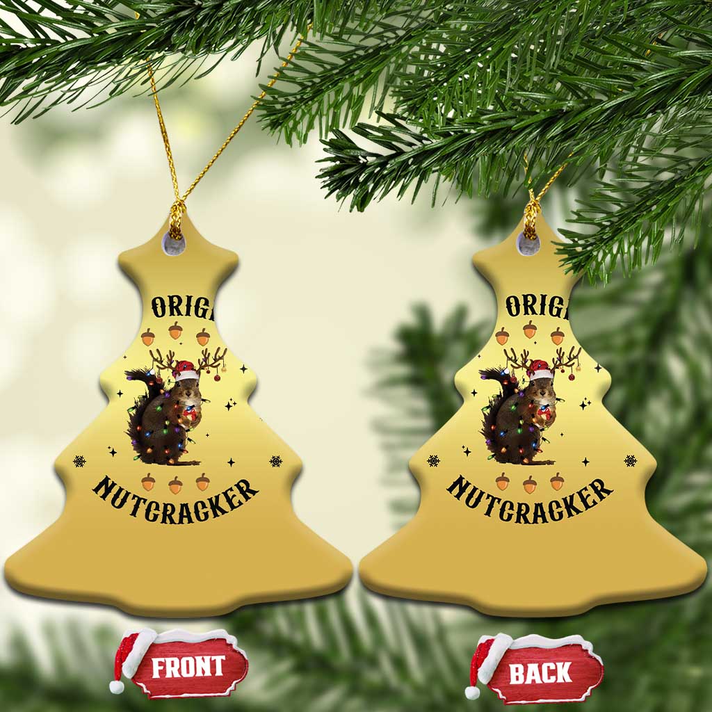 Gold bell Christmas ornaments with nutcracker squirrel graphic, shown front and back.