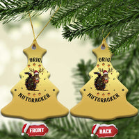 Gold bell Christmas ornaments with nutcracker squirrel graphic, shown front and back.