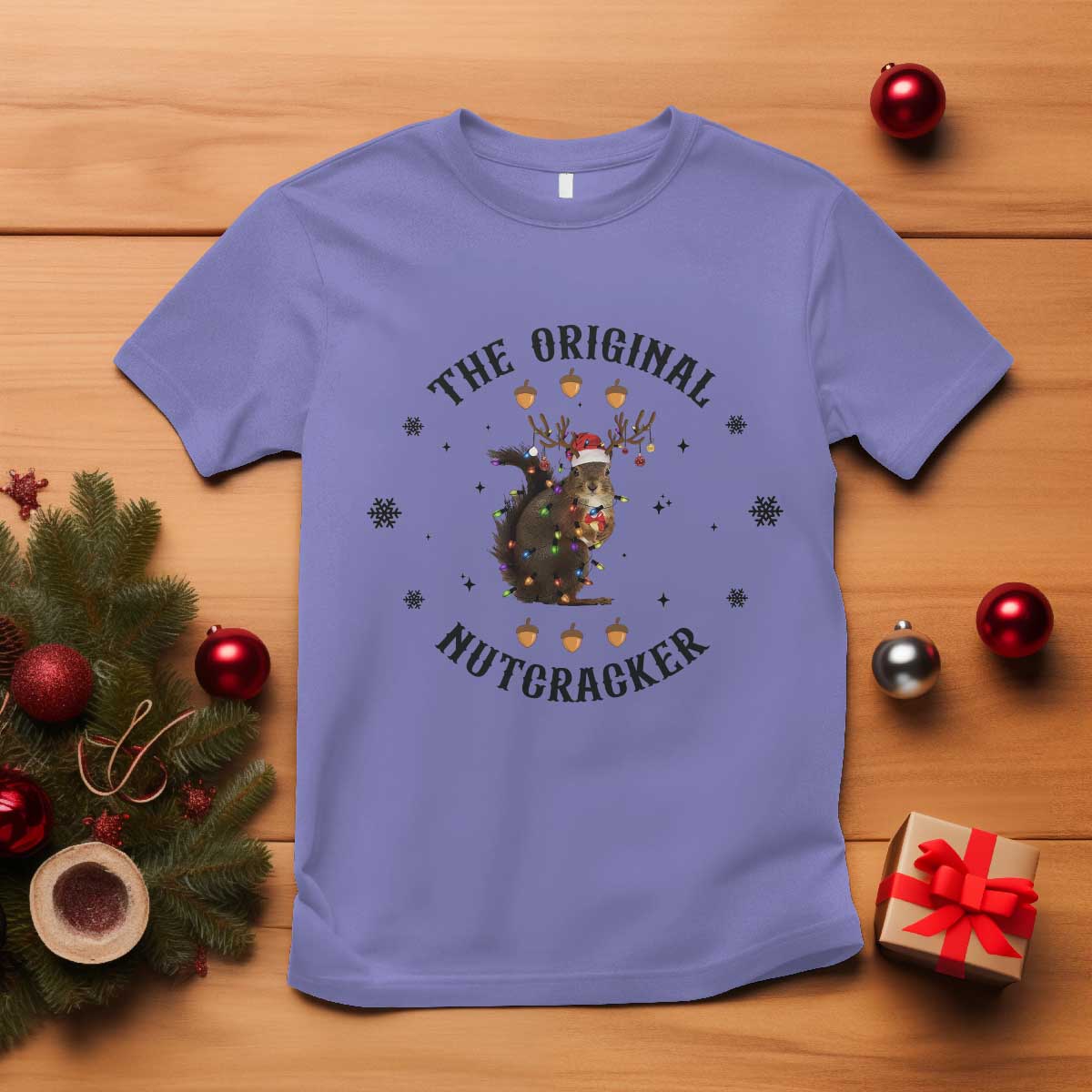Violet crew-neck T-shirt with “The Original Nutcracker” squirrel graphic.