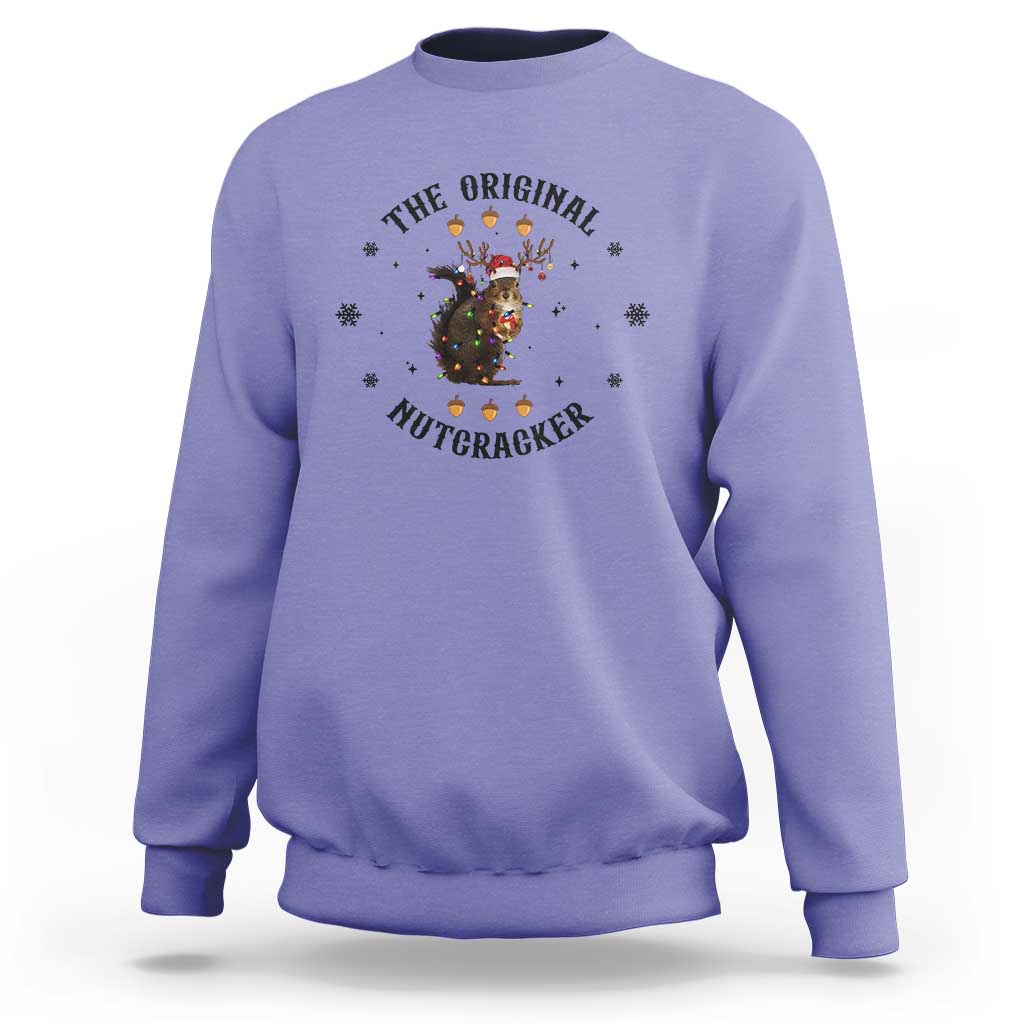 Violet crewneck sweatshirt with nutcracker graphic and winter snowflake accents
