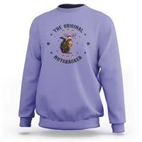 Violet crewneck sweatshirt with nutcracker graphic and winter snowflake accents