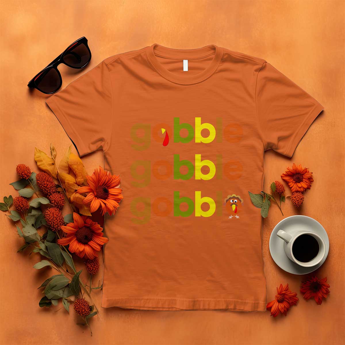 Orange funny Thanksgiving t-shirt with “gobble gobble” text and turkey graphic