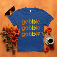 Blue funny Thanksgiving t-shirt with “gobble gobble” text and turkey graphic
