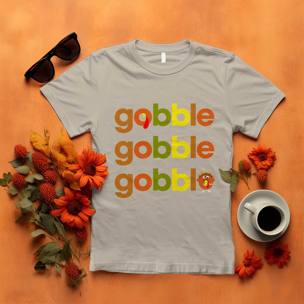 Light gray funny Thanksgiving t-shirt with “gobble gobble” text and turkey graphic