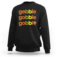 Black sweatshirt with “gobble gobble gobble” text and small turkey graphic on chest