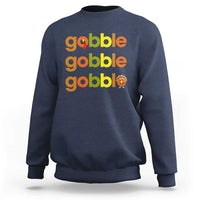 Navy sweatshirt with “gobble gobble gobble” text and small turkey graphic on chest
