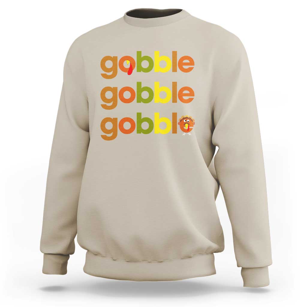 Sand sweatshirt with “gobble gobble gobble” text and small turkey graphic on chest