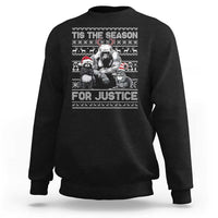 Black crewneck sweatshirt with “Tis the Season for Justice” graphic and long sleeves
