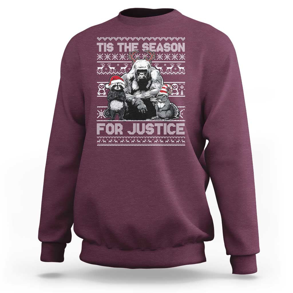Maroon crewneck sweatshirt with “Tis the Season for Justice” graphic and long sleeves