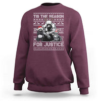 Maroon crewneck sweatshirt with “Tis the Season for Justice” graphic and long sleeves