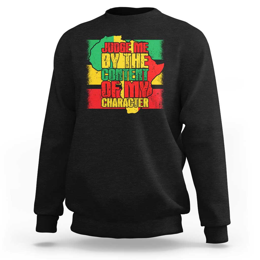 Black crewneck sweatshirt with colorful “Judge Me…” text and Africa map graphic on back