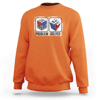 Orange crewneck sweatshirt with “Problem Solved” puzzle cube graphic
