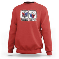 Red crewneck sweatshirt with “Problem Solved” puzzle cube graphic