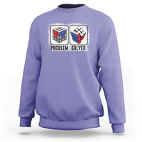 Violet crewneck sweatshirt with “Problem Solved” puzzle cube graphic