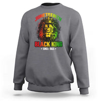 Light gray crewneck sweatshirt with colorful lion and Juneteenth Black King graphic