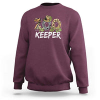 Maroon zookeeper sweatshirt with 'KEEPER' zoo animal graphic, long sleeves