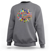 Dark heather gray crewneck sweatshirt with multicolor Caribbean American flower graphic on back