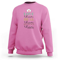 Pink crewneck sweatshirt with 'Love heal return them' nurse heart graphic