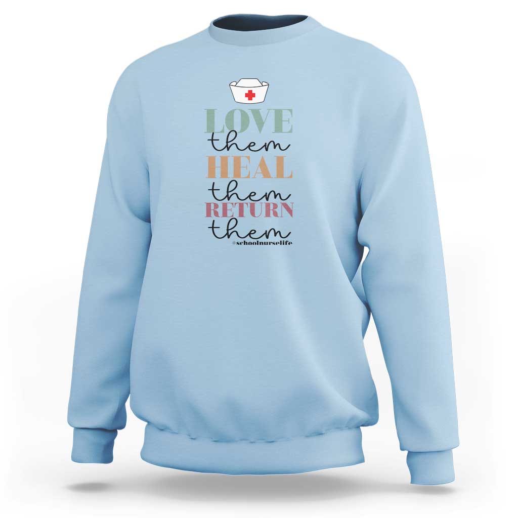 Light blue crewneck sweatshirt with 'Love heal return them' nurse heart graphic
