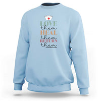 Light blue crewneck sweatshirt with 'Love heal return them' nurse heart graphic