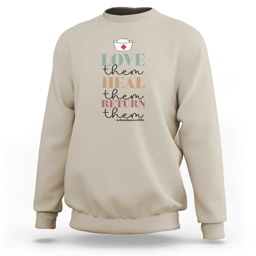 Sand beige crewneck sweatshirt with 'Love heal return them' nurse heart graphic