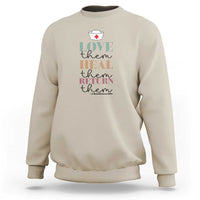 Sand beige crewneck sweatshirt with 'Love heal return them' nurse heart graphic