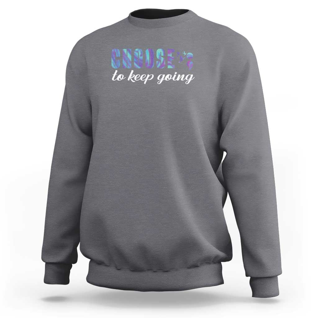 Heather gray crewneck sweatshirt with front “choose to keep going” colorful graphic.