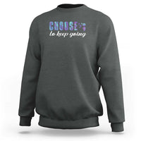 Dark green crewneck sweatshirt with centered “choose to keep going” graphic print on chest.