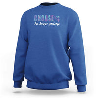 Royal blue crewneck sweatshirt with centered “choose to keep going” colorful graphic on chest.