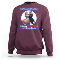Maroon sweatshirt with chest cat dancing graphic and “2 Steps Forward No Steps Back” text