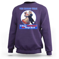Purple sweatshirt with chest cat dancing graphic and “2 Steps Forward No Steps Back” text