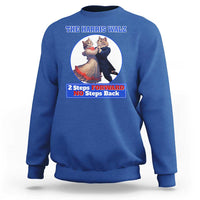 Royal blue sweatshirt with chest cat dancing graphic and “2 Steps Forward No Steps Back” text