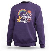 Purple crewneck sweatshirt with rainbow and 'Be a Buddy not a Bully' floral graphic