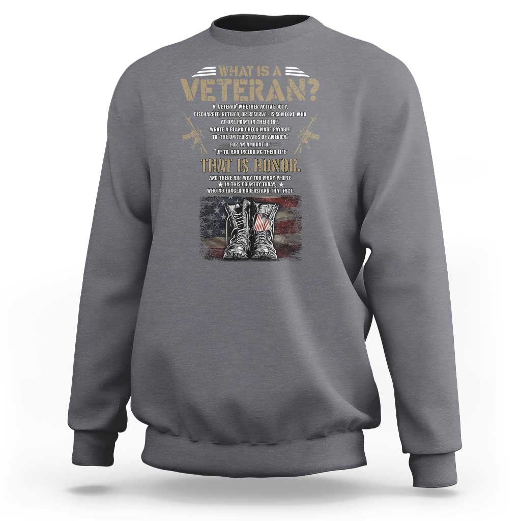 Dark heather veteran's day sweatshirt with graphic text and American flag boots on chest