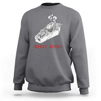 Charcoal gray skeleton graphic sweatshirt with coffin illustration and red “never better” text
