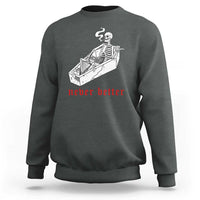 Dark heather gray skeleton graphic sweatshirt with coffin illustration and red “never better” text
